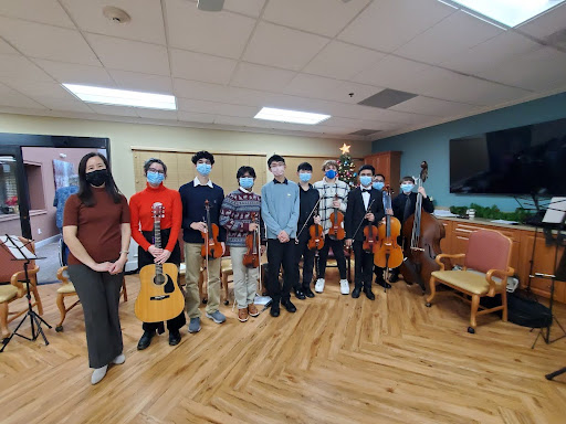 Piu Vivace performers pose for a photo after their performance at the Bridgeway Senior Center.