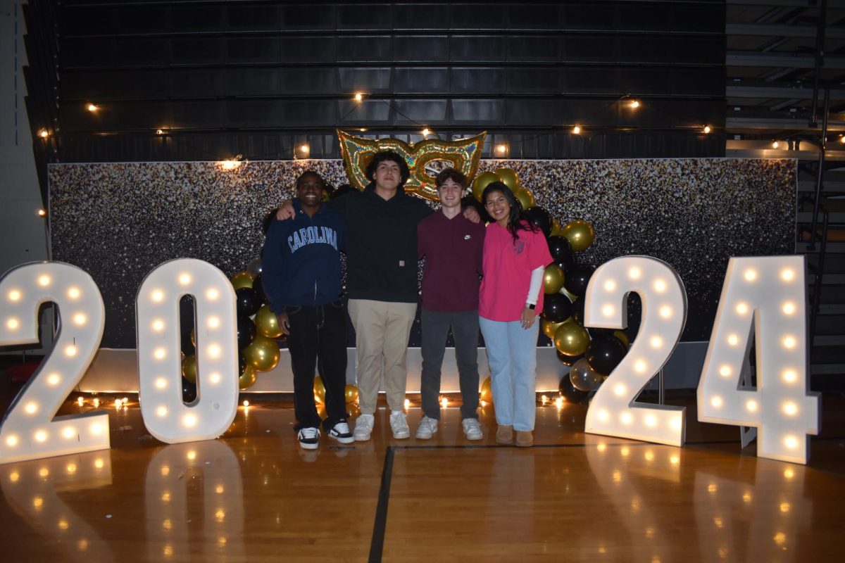 Students pose for a picture at the 2024 Winter Formal.
