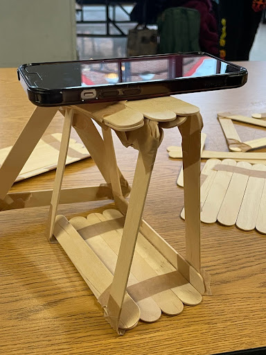 Students create bridges out of popsicle sticks during the Science National Honor Societys Engineering Expo.