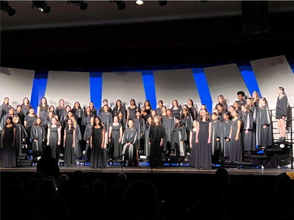 The choir performs on stage.